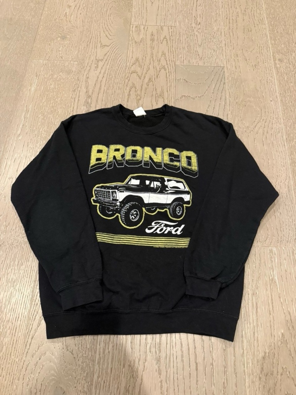 Junk Food Clothing Black Crewneck with Yellow Bronco Graphic